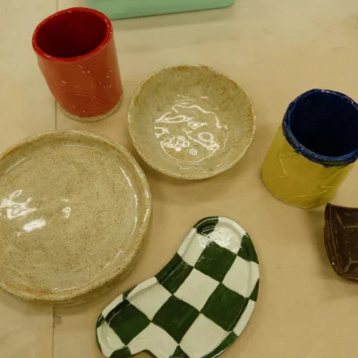 Hand-built cups, bowls and a green checkered dish